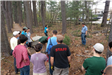 Volunteers on the trail with building in background