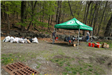 Volunteer tent and bags of trash